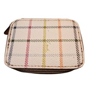 COACH Triple Pill Case in the  Tattersall print with gold trim.